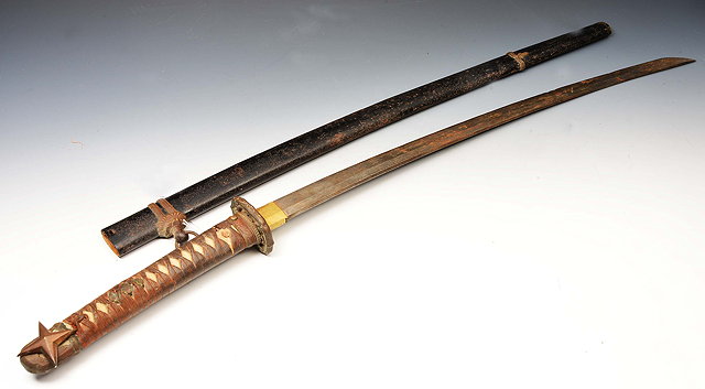 Appraisal: A JAPANESE SWORD with steel blade lizard skin and leather