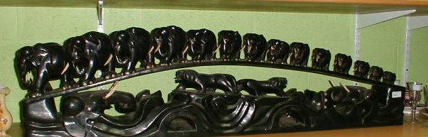 Appraisal: A Sri Lankan carved ebony train of fourteen graduated elephants