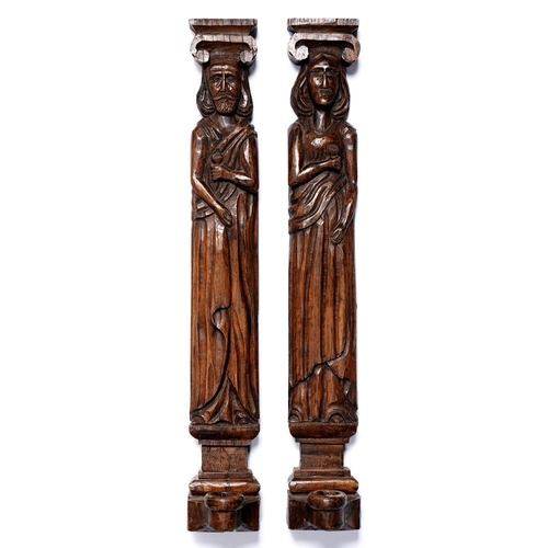 Appraisal: A pair of 'carved oak' resin medieval figural wall sconces