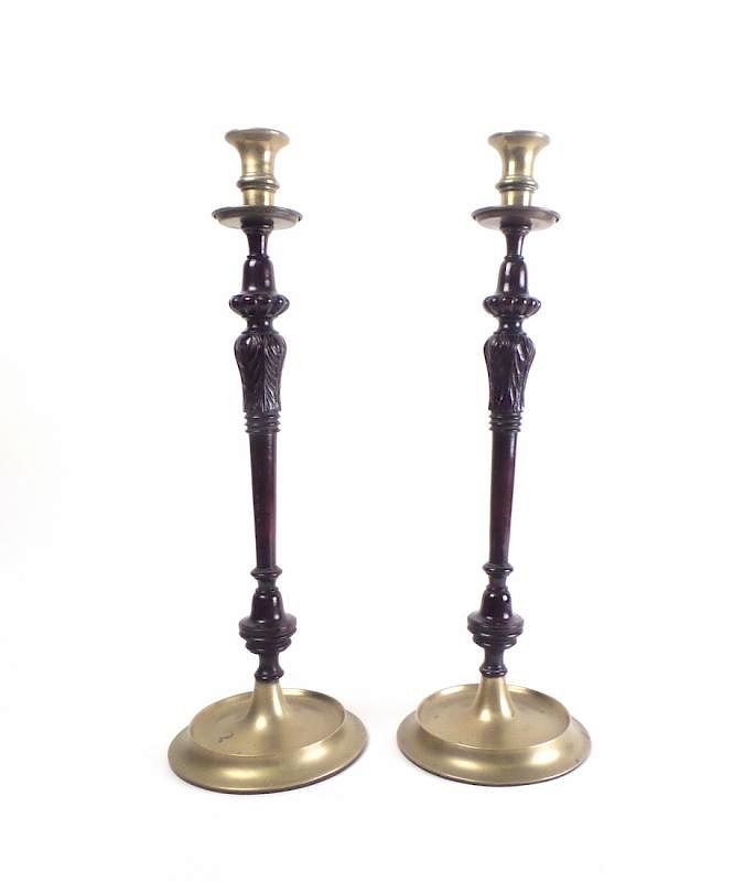 Appraisal: Pair of Wooden Candlesticks Wooden candlesticks with turned and carved