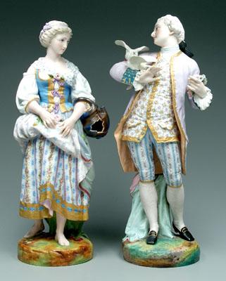 Appraisal: Two bisque figurines large scale she holding flowers and wearing