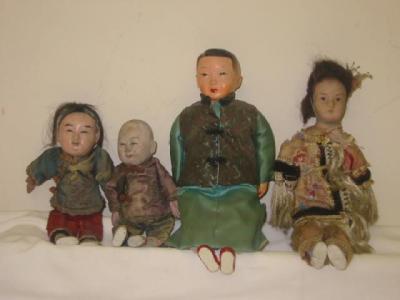 Appraisal: Three various composition head Japanese boy dolls in national costume