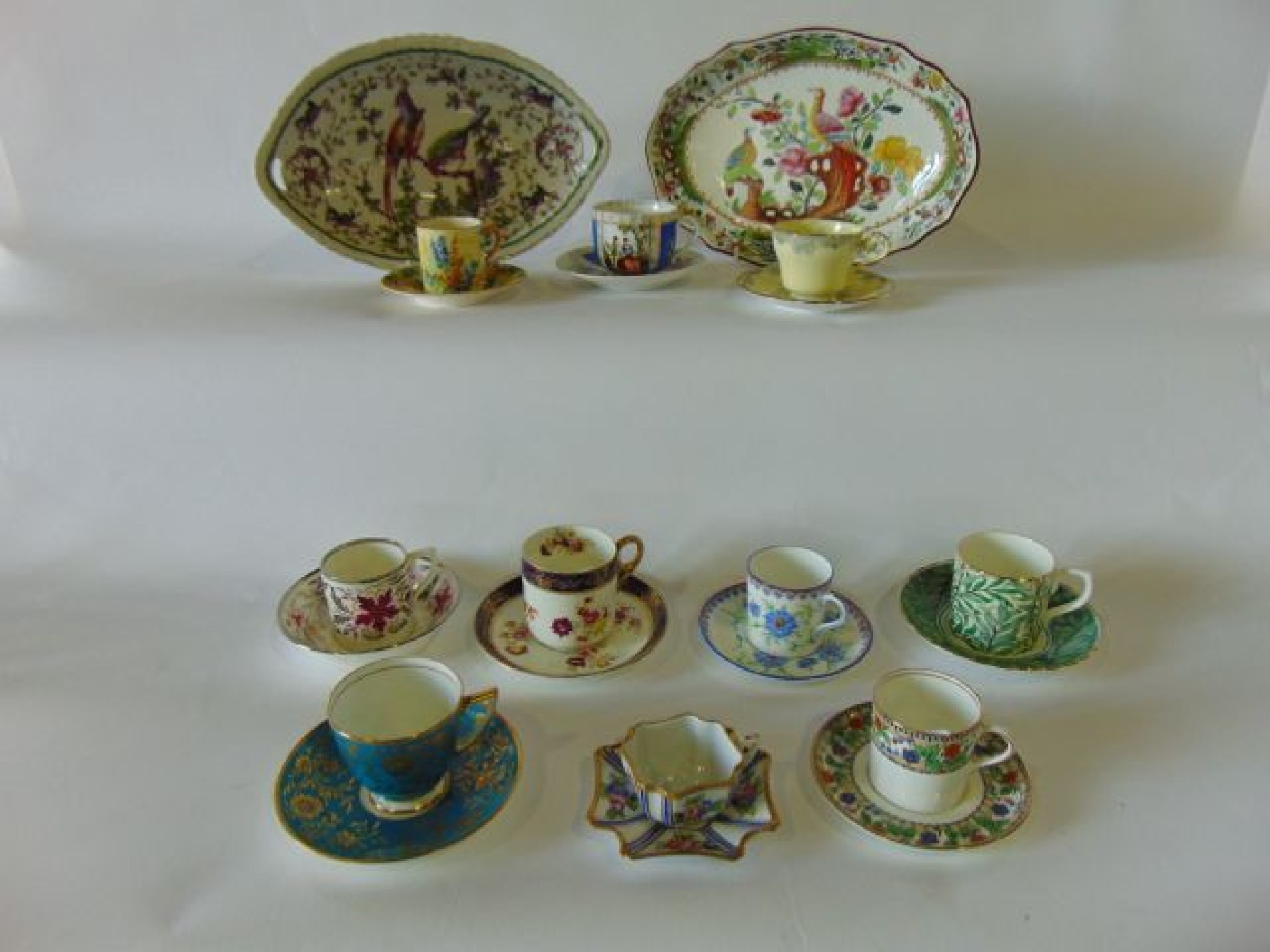 Appraisal: A quantity of various decorative coffee cans and saucers including