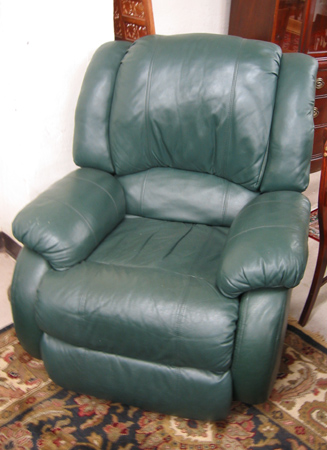 Appraisal: A CONTEMPORARY GREEN LEATHER ROCKING RECLINER American made recent manufacture