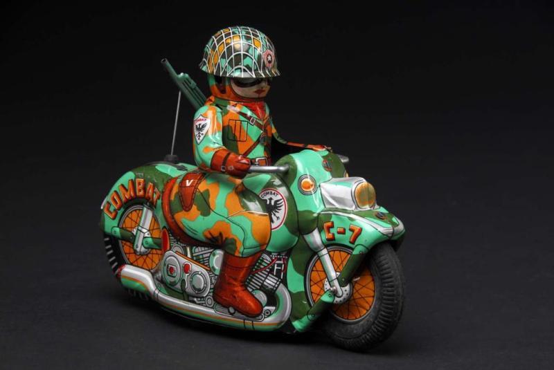 Appraisal: Tin C- Combat Motorcycle Friction Toy Description Japanese Working Beautiful