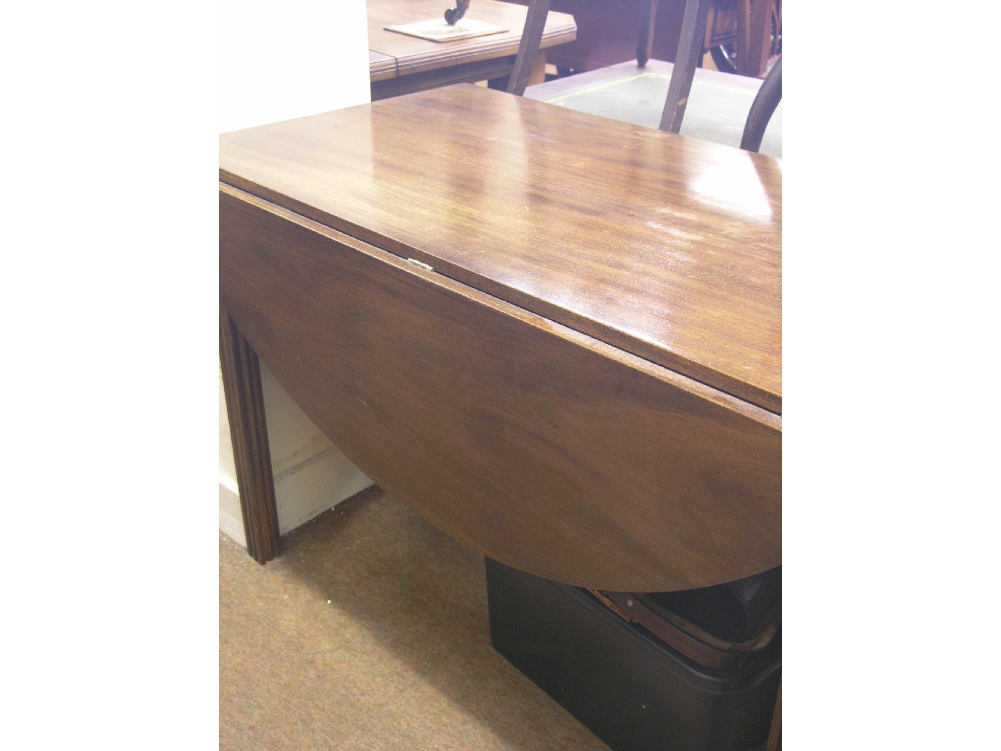 Appraisal: A Chippendale-style mahogany drop-leaf dining table on moulded square legs