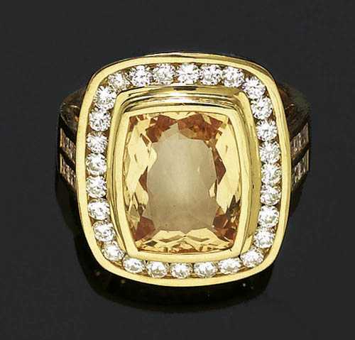 Appraisal: TOPAZ AND BRILLIANT-CUT DIAMOND RING Yellow gold Casual-elegant ring the