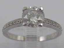 Appraisal: A white metal tests ct gold diamond solitaire ring with