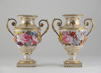 Appraisal: A pair of Derby two-handled vases painted with flowers and