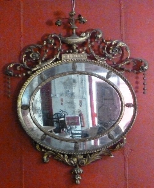 Appraisal: A th Century oval wall mirror the gilt plaster frame