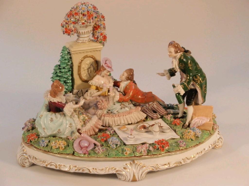 Appraisal: A Sitzendorf figure group of a picnic two courting couples