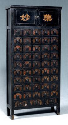 Appraisal: Chinese apothecary cabinet black lacquered exotic wood mortise-and-tenon construction two