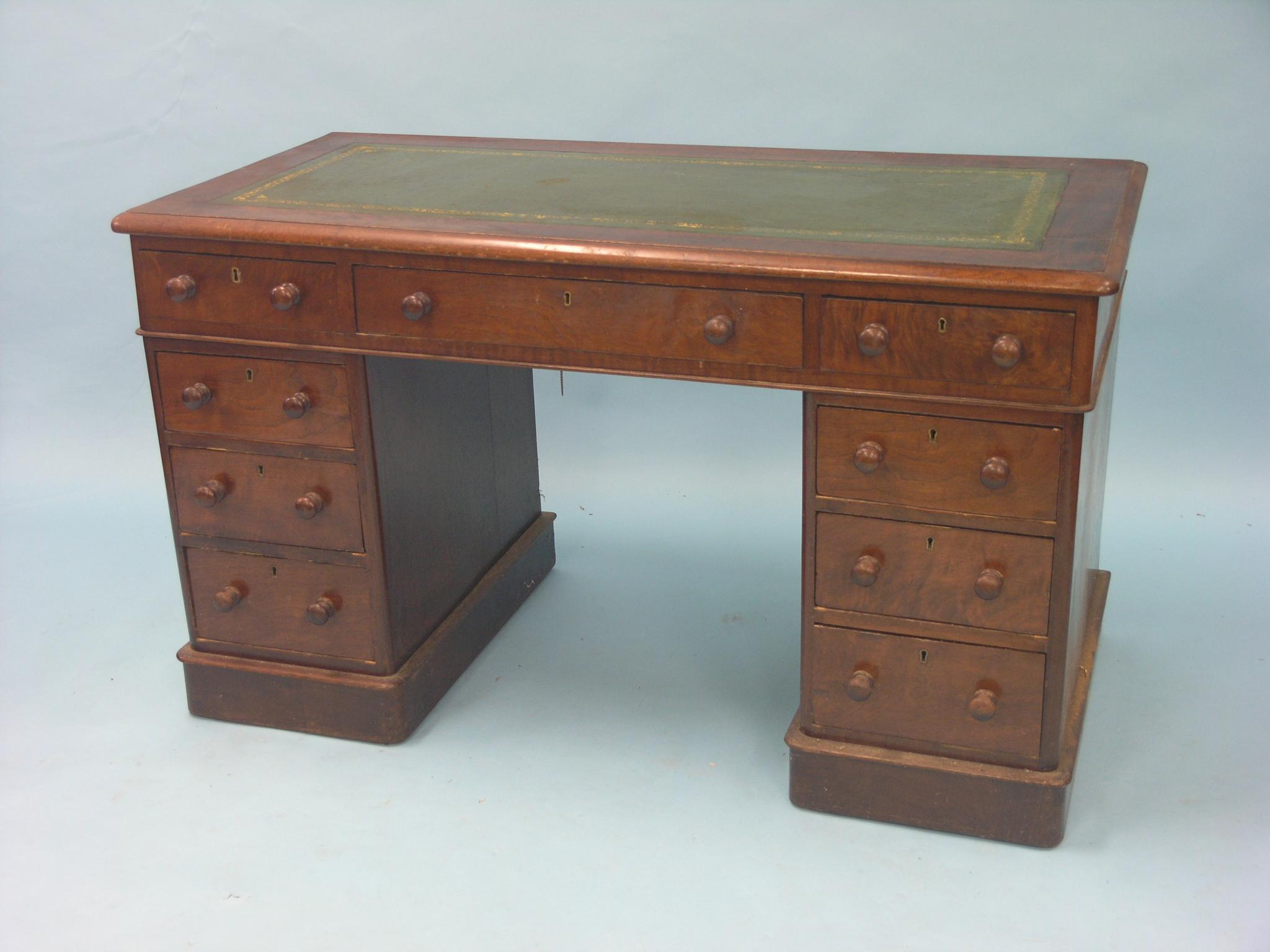 Appraisal: A Victorian walnut pedestal desk with inset gilt-tooled leather top