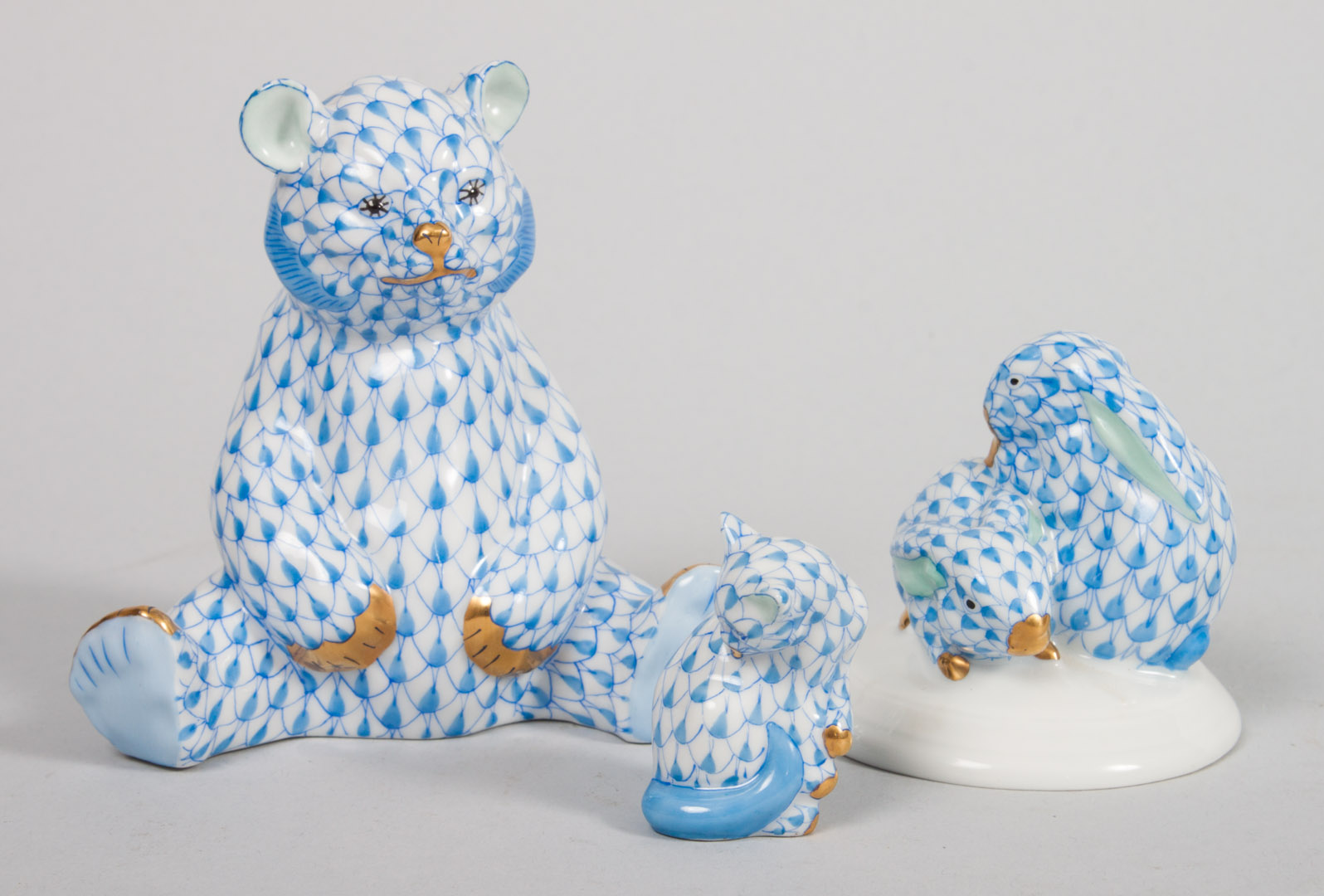 Appraisal: Three Herend porcelain animals in the Blue Fishnet pattern including