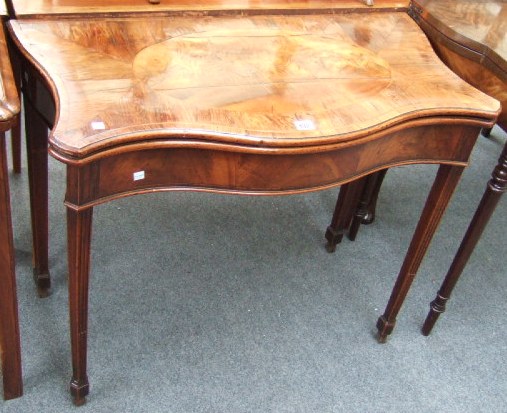 Appraisal: A George III mahogany serpentine card table of Hepplewhite design