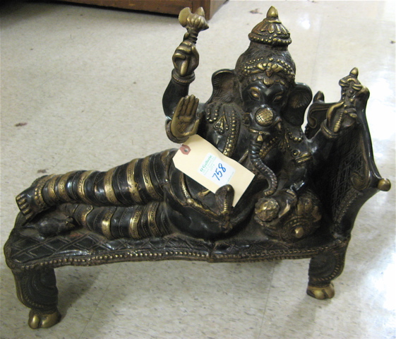 Appraisal: EAST INDIAN BRONZE SCULPTURE the elephant-headed figure of Ganesha reclining