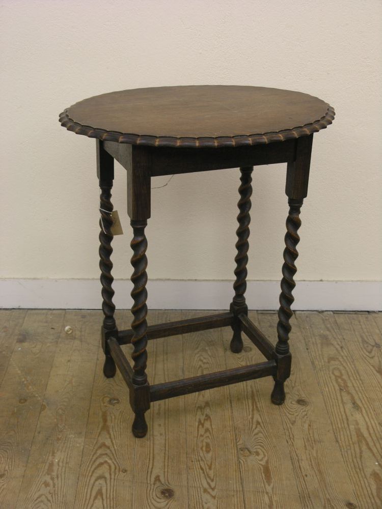 Appraisal: A solid dark oak occasional table oval top on barley