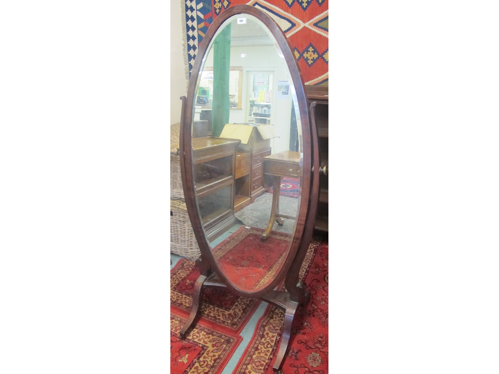 Appraisal: An Edwardian mahogany cheval mirror