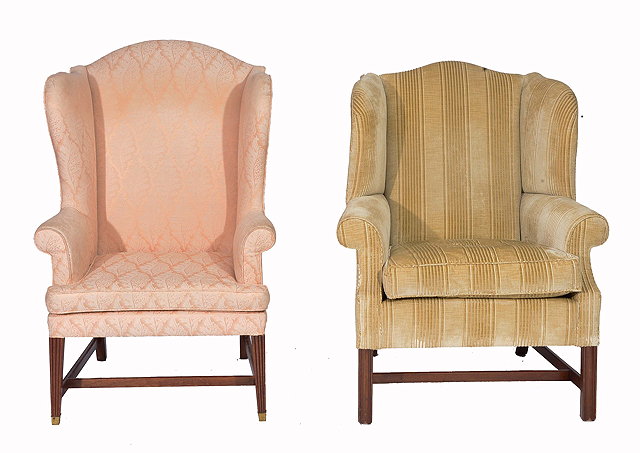 Appraisal: TWO GEORGIAN STYLE WING ARMCHAIRS each on mahogany fluted legs