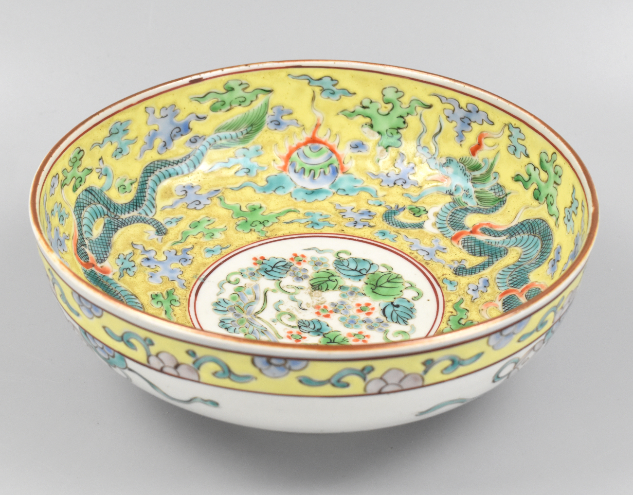 Appraisal: A large yellow ground green dragon bowl dating from the