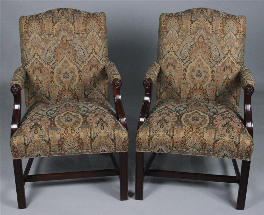 Appraisal: COUNCIL CRAFTSMAN PAIR OF CHIPPENDALE STYLE MAHOGANY LOLLING CHAIRS serpentine