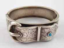 Appraisal: A Victorian silver bangle designed as a buckle and set