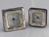 Appraisal: Two silver faced quartz alarm clocks cm square