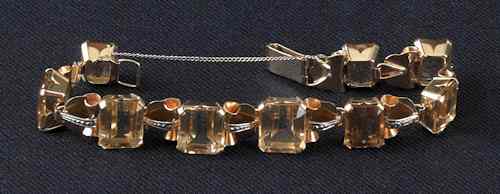 Appraisal: K citrine bracelet with nine step cut graduated size citrines