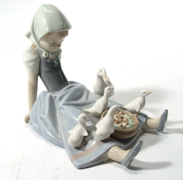 Appraisal: Hand painted Lladro figurine a young girl with geese printed