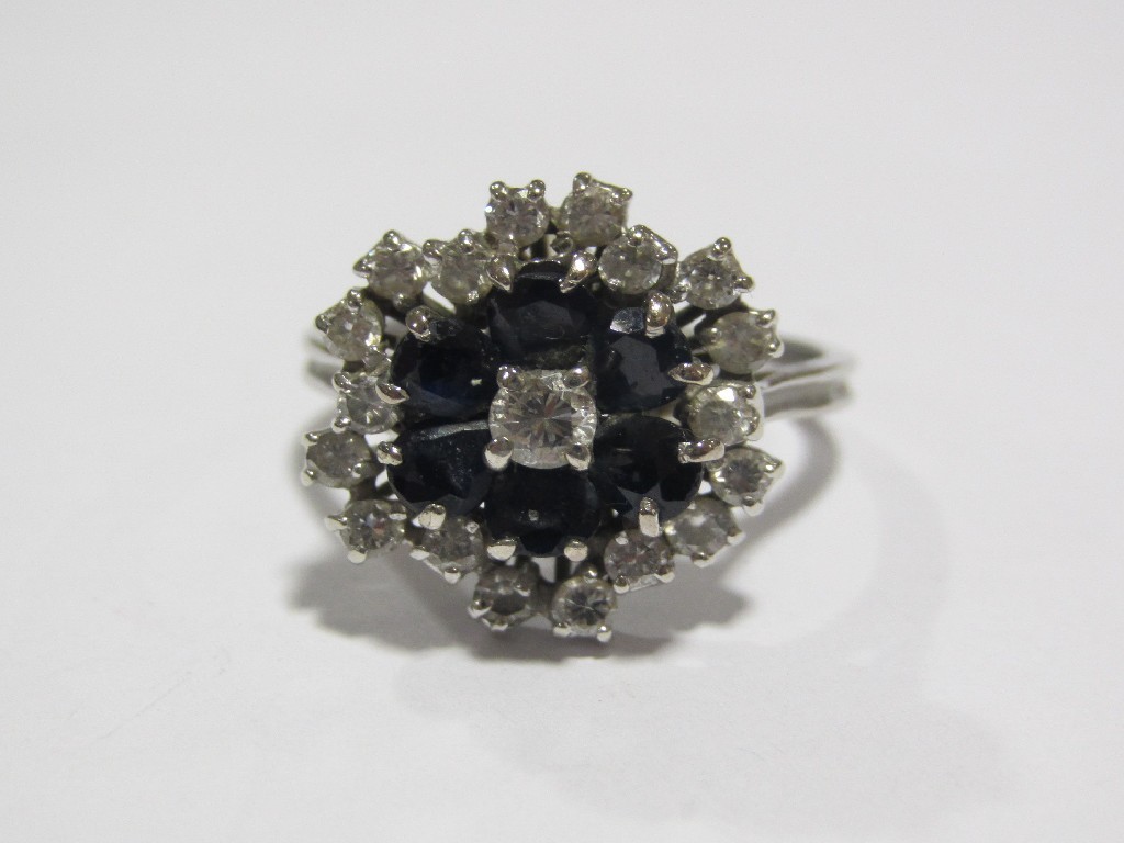 Appraisal: Eighteen carat white gold sapphire and diamond flower head cluster