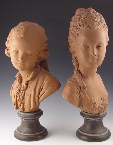 Appraisal: PAIR TERRA COTTA BUSTS Female measures '' h small chip