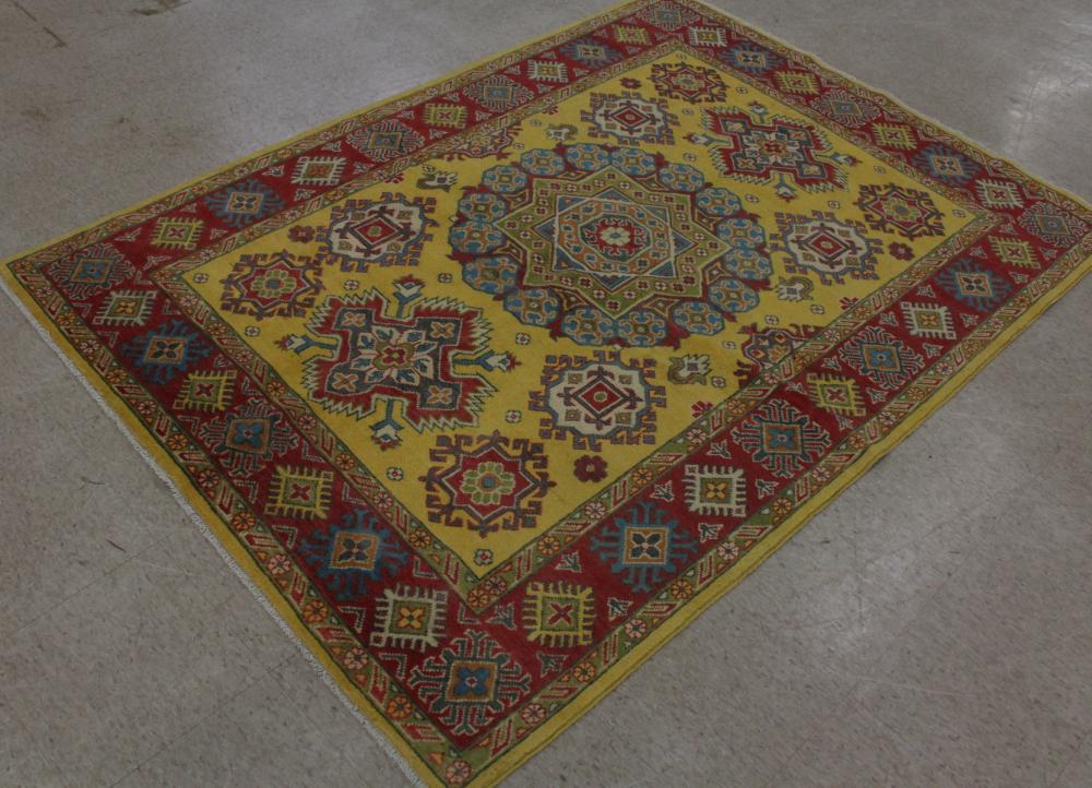 Appraisal: HAND KNOTTED ORIENTAL AREA RUG Pakistani Kazak geometric design on