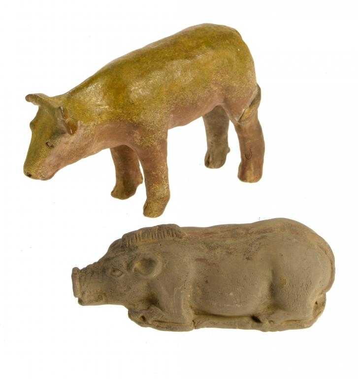 Appraisal: AN EARTHENWARE MODEL OF A BULL AND A RECUMBENT BOAR