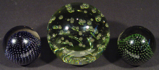 Appraisal: Two Holmegaard globular glass paperweights with internal air bubbles together