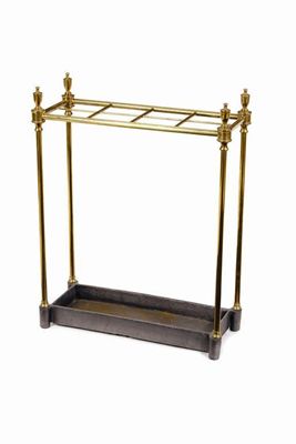 Appraisal: A turned brass eight division stickstand with a cast iron