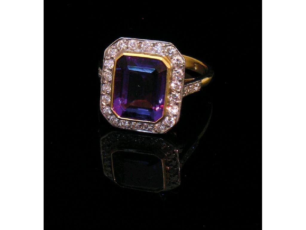 Appraisal: AN AMETHYST AND DIAMOND CLUSTER DRESS RING the central emerald-cut