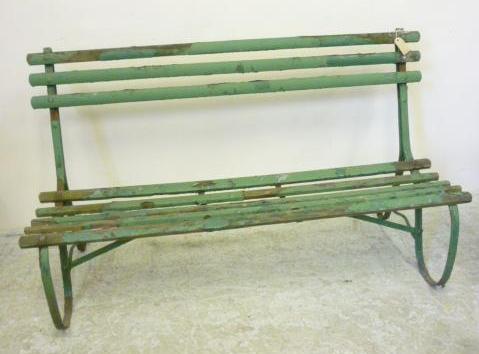 Appraisal: A WROUGHT IRON GARDEN BENCH c with slatted seat and