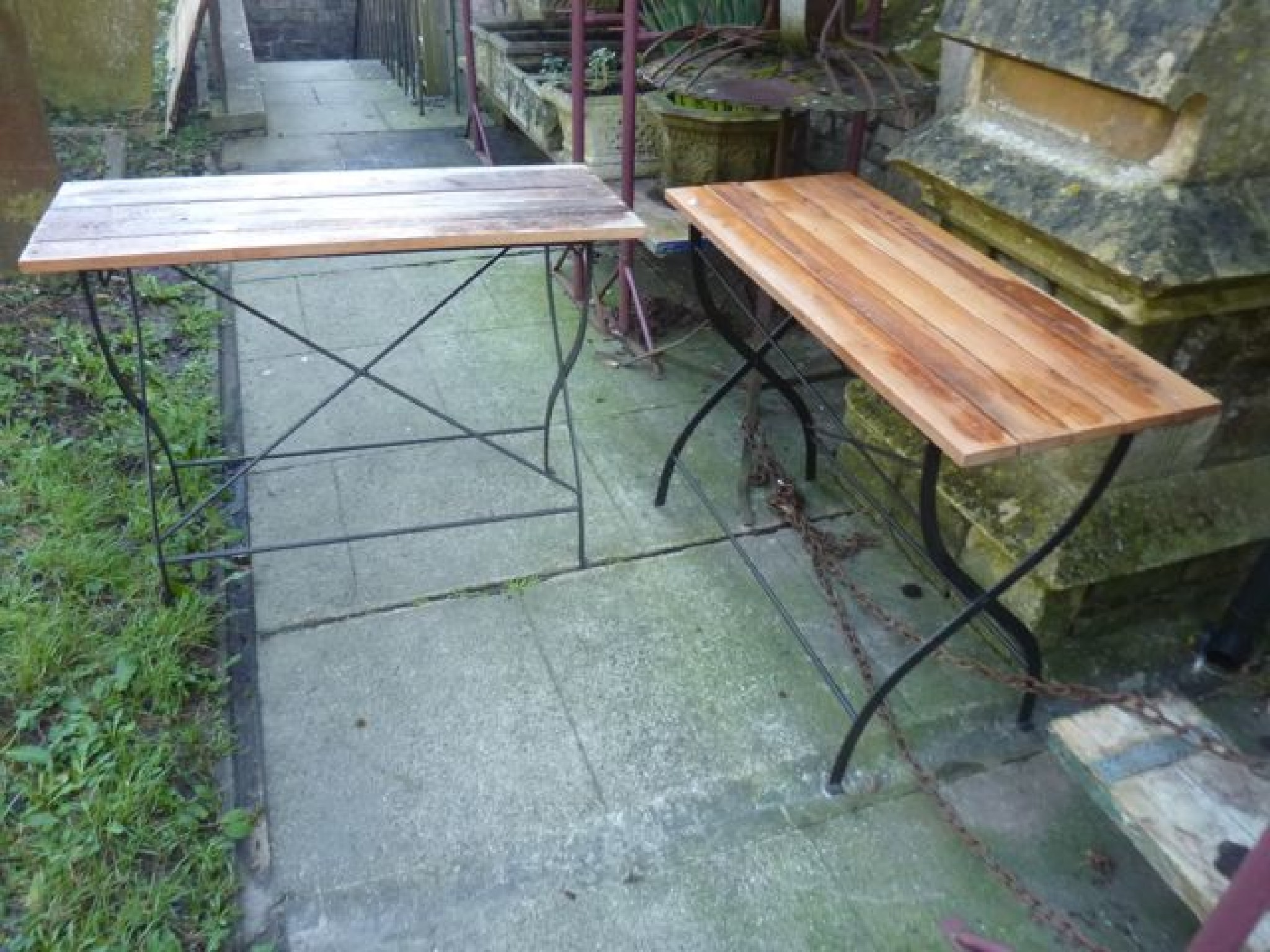 Appraisal: A pair of contemporary teakwood folding garden tables with x-framed