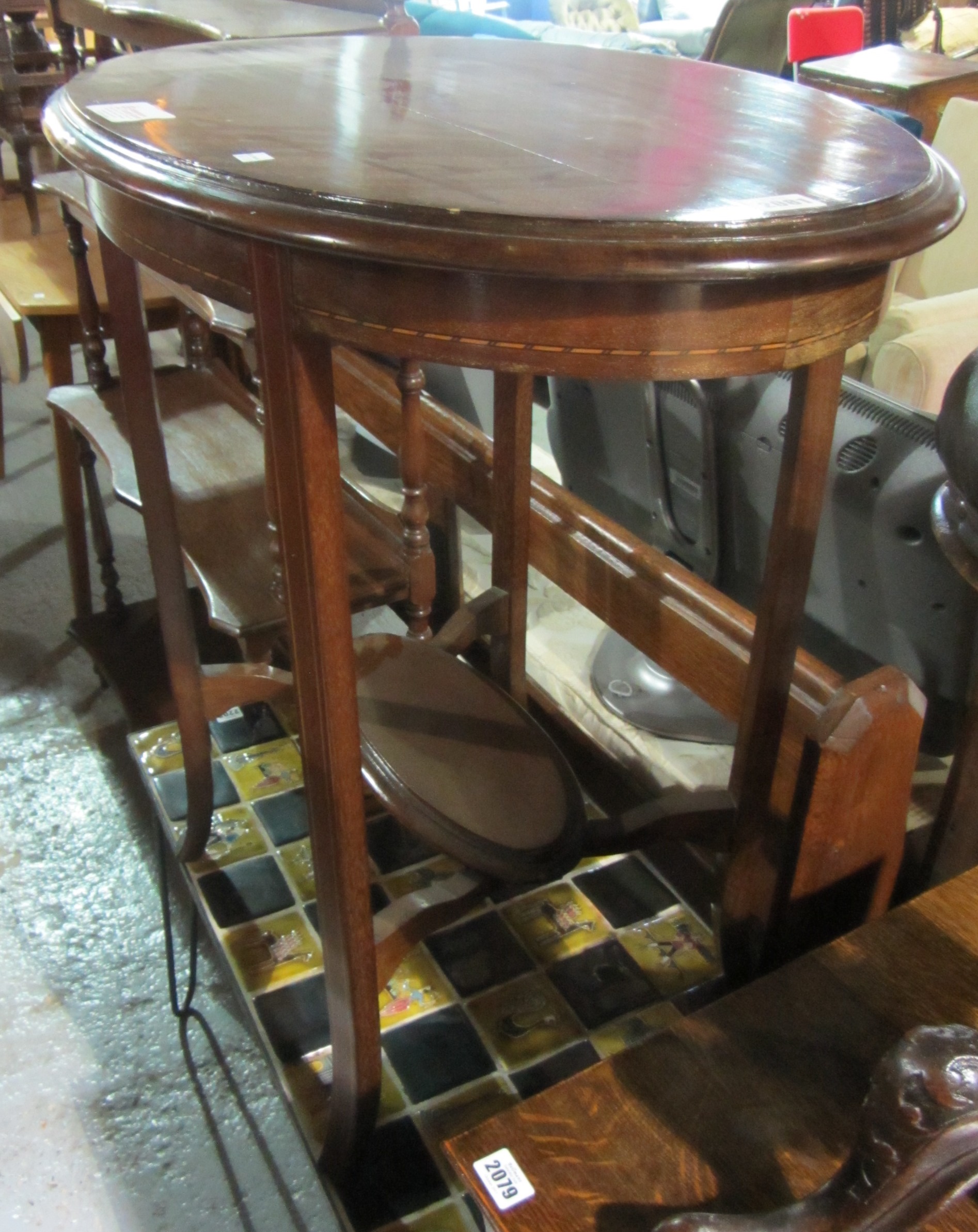 Appraisal: A th century mahogany oval occasional table