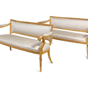 Appraisal: A Pair of Northern Italian Giltwood Sofas with Griffin Supports