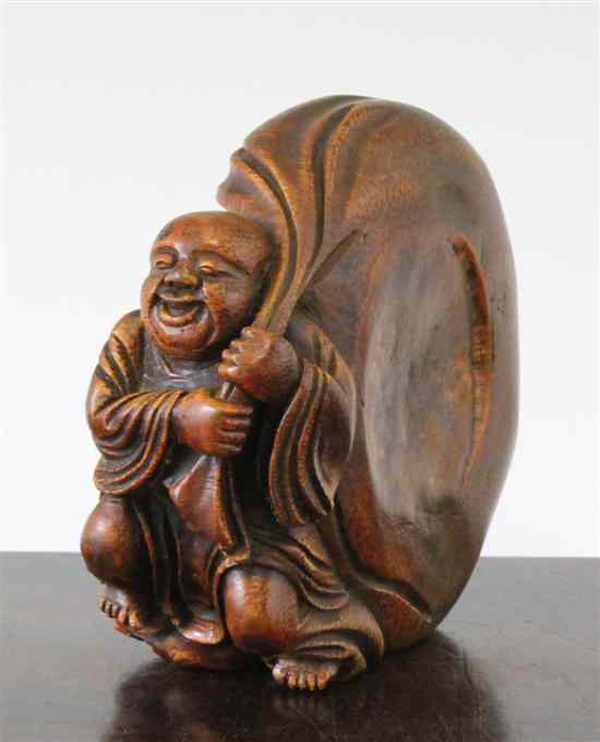 Appraisal: A Chinese bamboo carving of Budai and his sack of