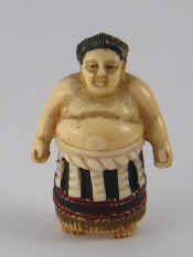 Appraisal: A Japanese ivory netsuke of a sumo wrestler signed beneath