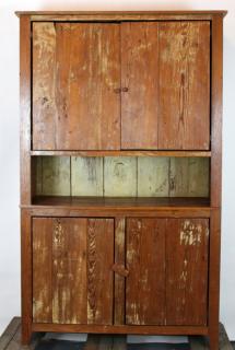 Appraisal: American primitive pine door cupboard American primitive pine door cupboard