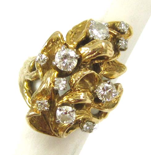 Appraisal: DIAMOND AND FOURTEEN KARAT GOLD RING set with ten round-cut