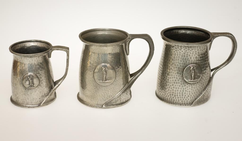 Appraisal: TWO LIBERTY CO TUDRIC PEWTER GOLFING TANKARDS each with a