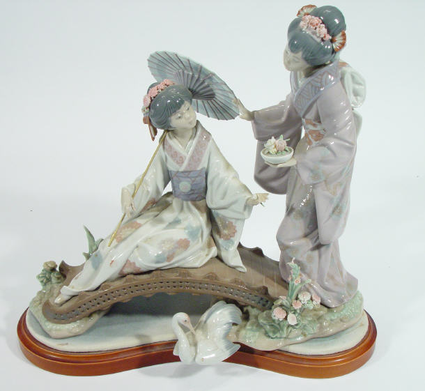 Appraisal: Lladro porcelain figure group of geisha girls on a bridge