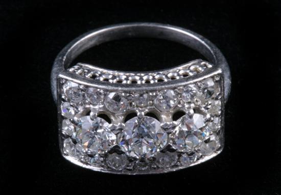 Appraisal: EDWARDIAN PLATINUM AND DIAMOND ARCHED RECTANGULAR DESIGN RING Row of