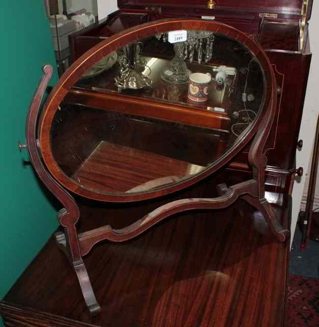 Appraisal: A VICTORIAN MAHOGANY SWING TOILET MIRROR