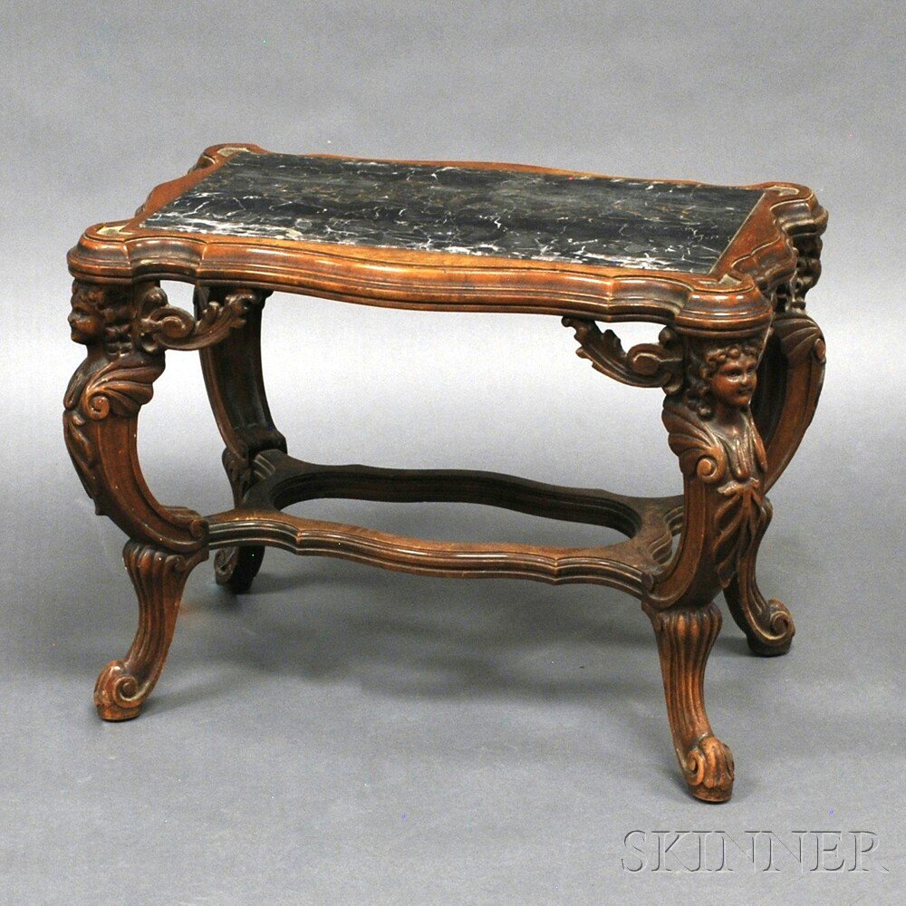 Appraisal: Renaissance-style Carved Walnut Marble-top Table late th century the shaped