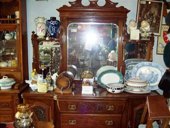 Appraisal: A THREE DRAWER MIRROR BACK EDWARDIAN SIDEBOARD